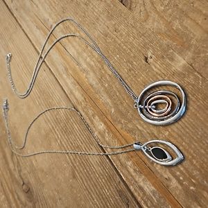 Set of long pendant necklaces.